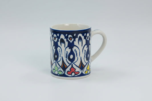 Mug with blue and white floral pattern on a white background